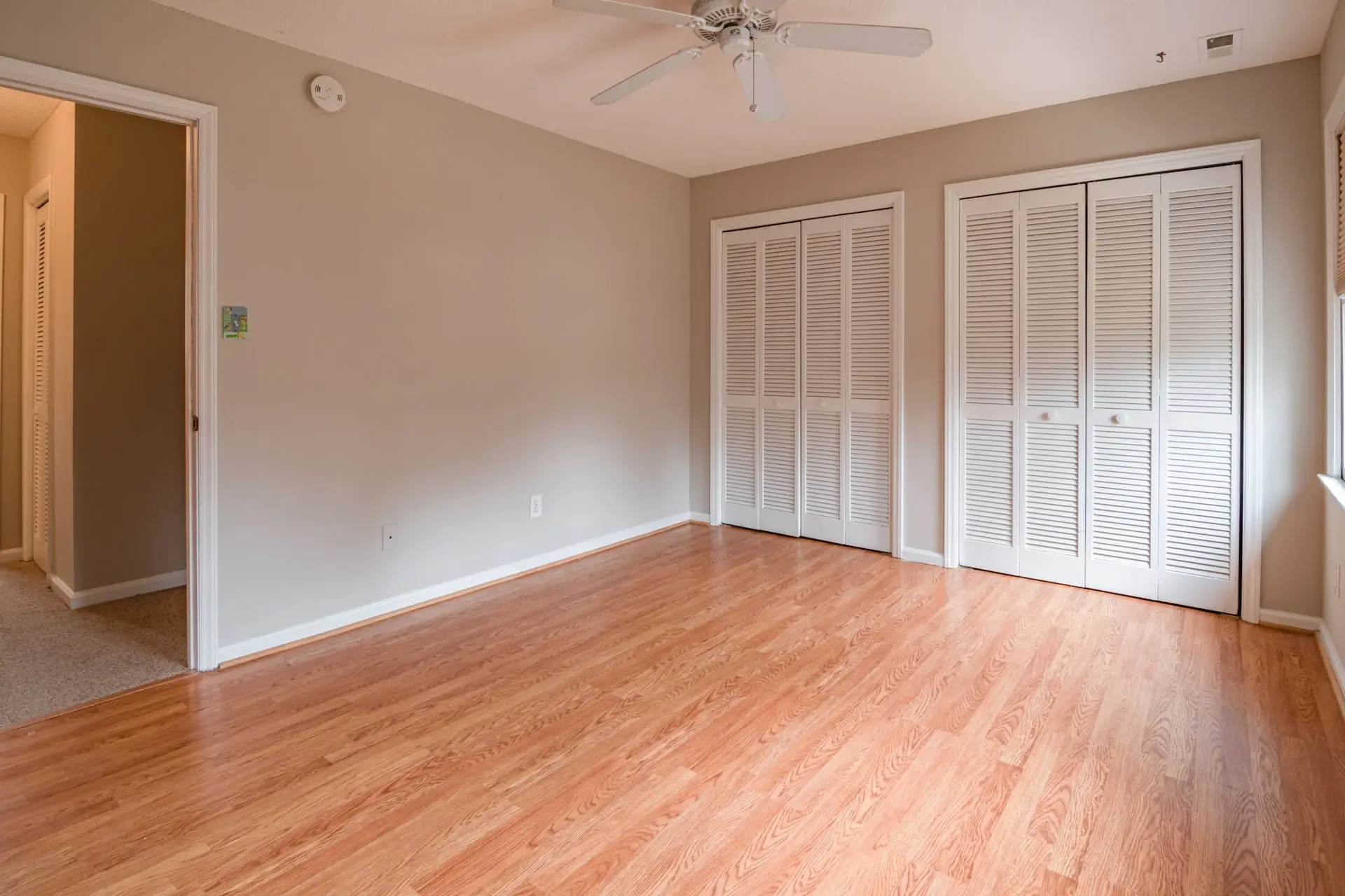 Hardwood flooring in a bright bedroom