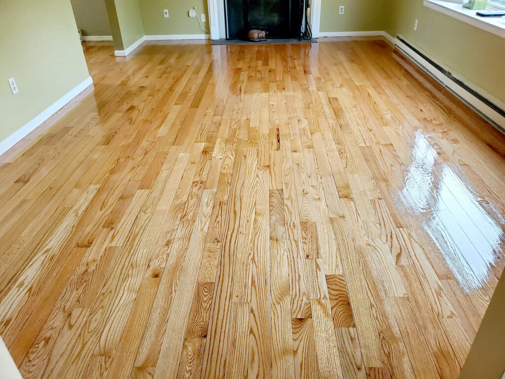 Sanding and Refinishing Hardwood Floors in Livingroom with Fireplace