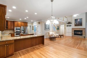 Red Oak Hardwood Flooring in open concept living room and kitchen